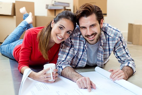 Bay Area couple in home looking over mover quotes