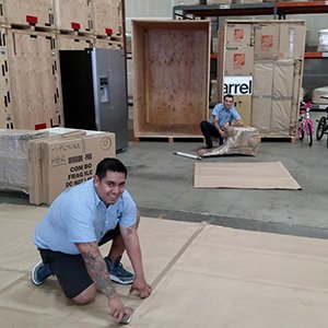 Moving Team Working to Prepare Items for Storage