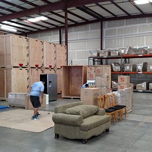 Moving Professionals Prepare Furniture for Storage