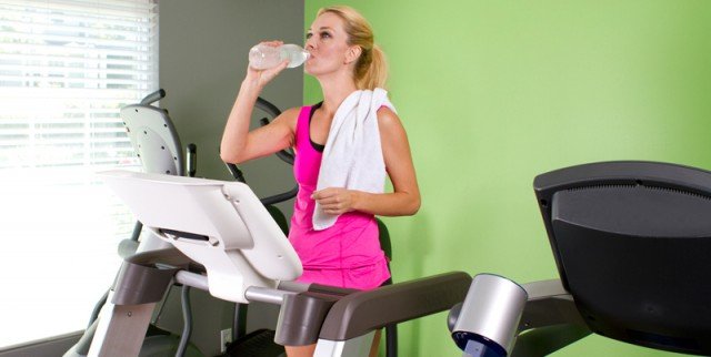 Woman Ready to Move her Home Exercise Machines